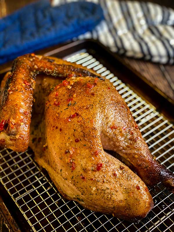 Sweet Thai Chili BBQ Turkey cooling on a wire rack