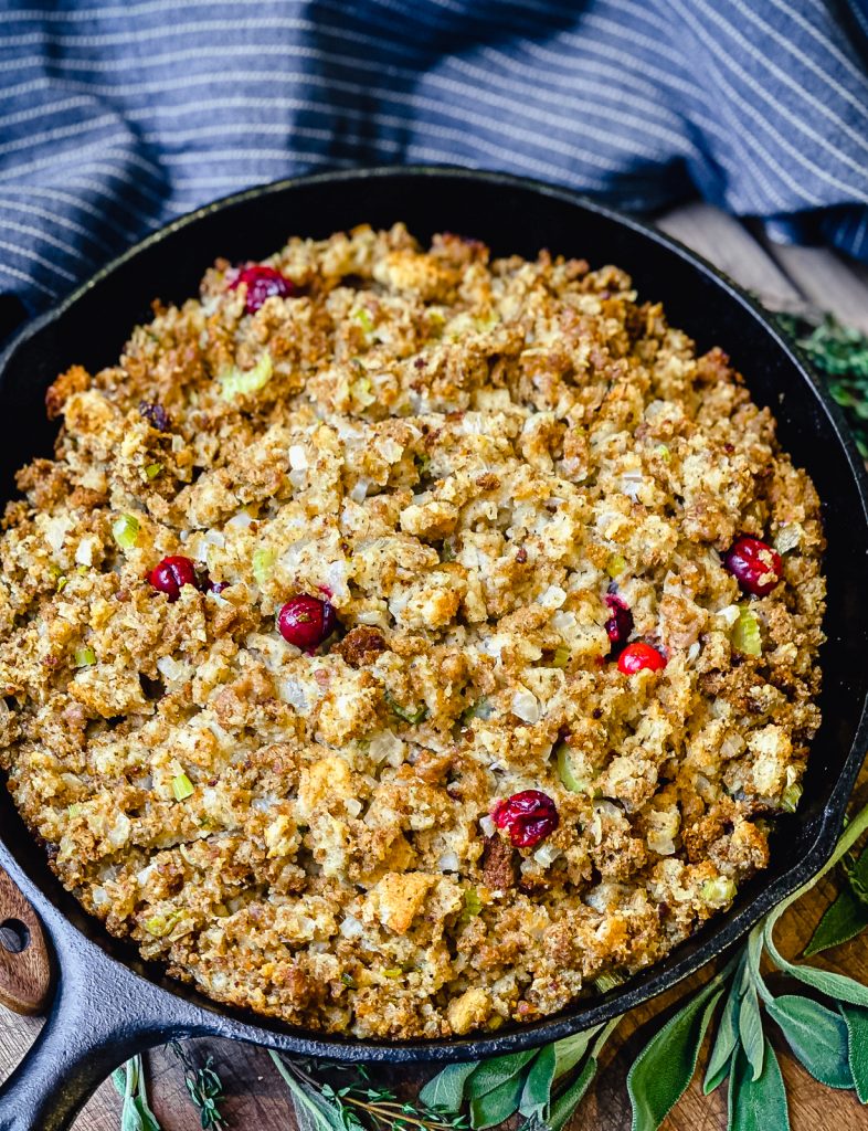 cranberry sausage stuffing in a cast iron pan