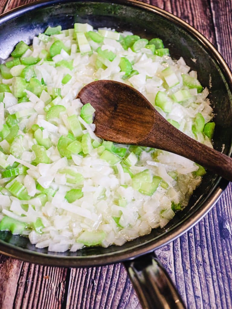 celery and onions cooking for cranberry sausage stuffing recipe