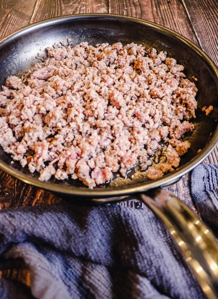 sausage in a pan cooked for cranberry sausage stuffing
