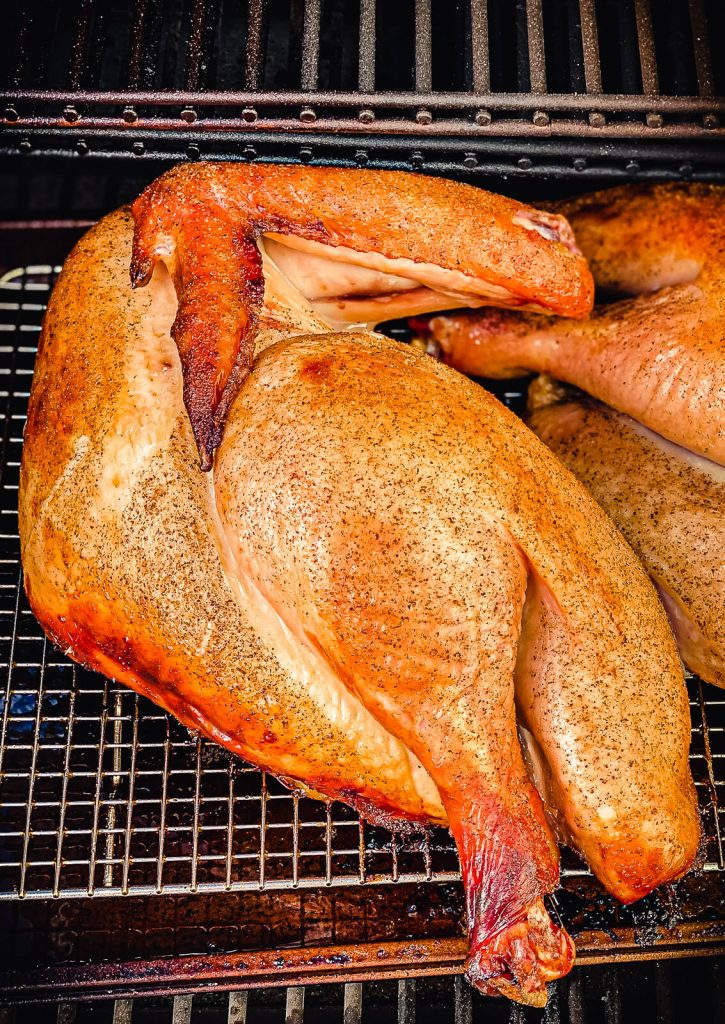turkey cooking on a smoker