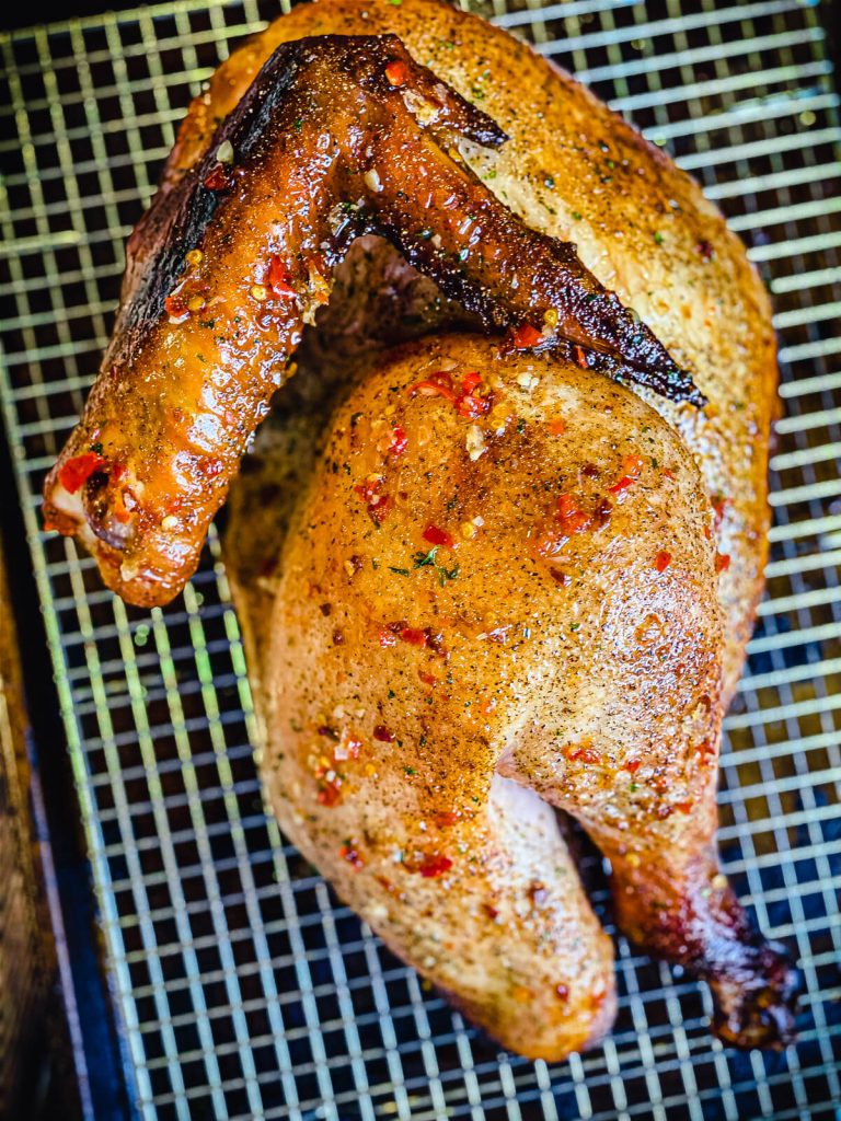 thai chili turkey half on a cooling rack