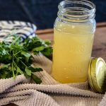 seafood stock jarred with parsley