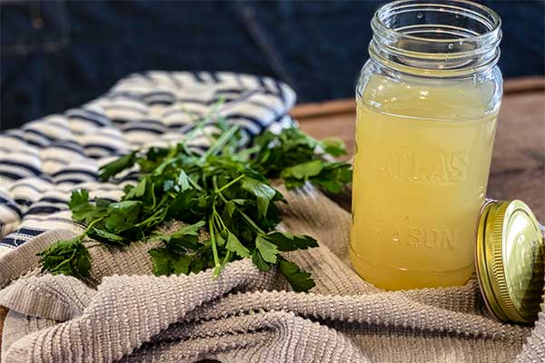 Seafood stock jarred with parsley