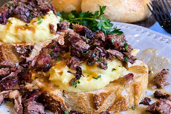 Open-faced hot beef sandwich ready for serving