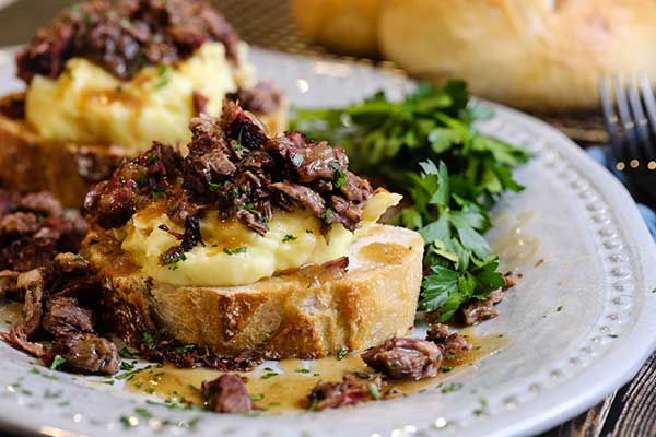 Open-faced hot beef sandwich ready to eat