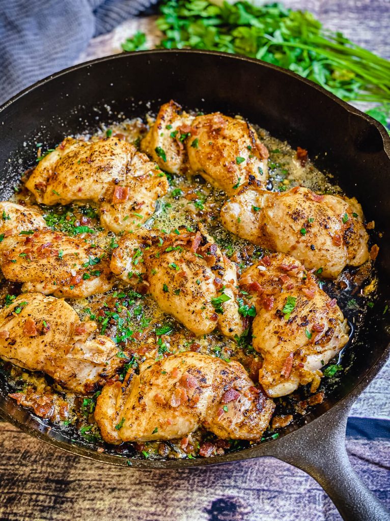 cast iron pan with garlic parmesan chicken thighs