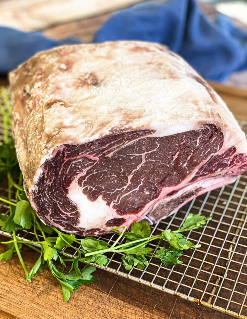 dry brined prime rib roast on a wire rack