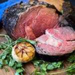 sliced grilled prime rib on a cutting board