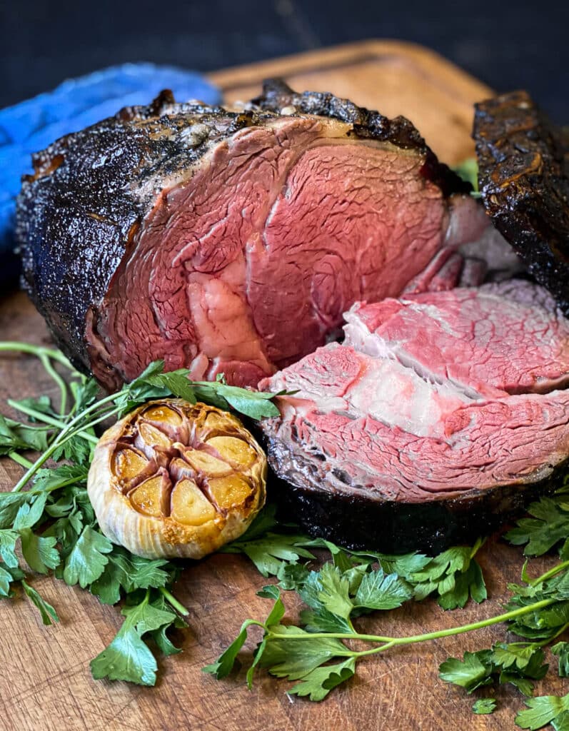 sliced grilled prime rib on a cutting board