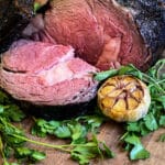 prime rib, grilled and sliced on a cutting board