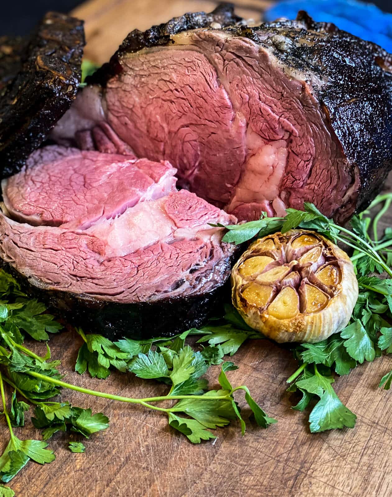 prime rib, grilled and sliced on a cutting board