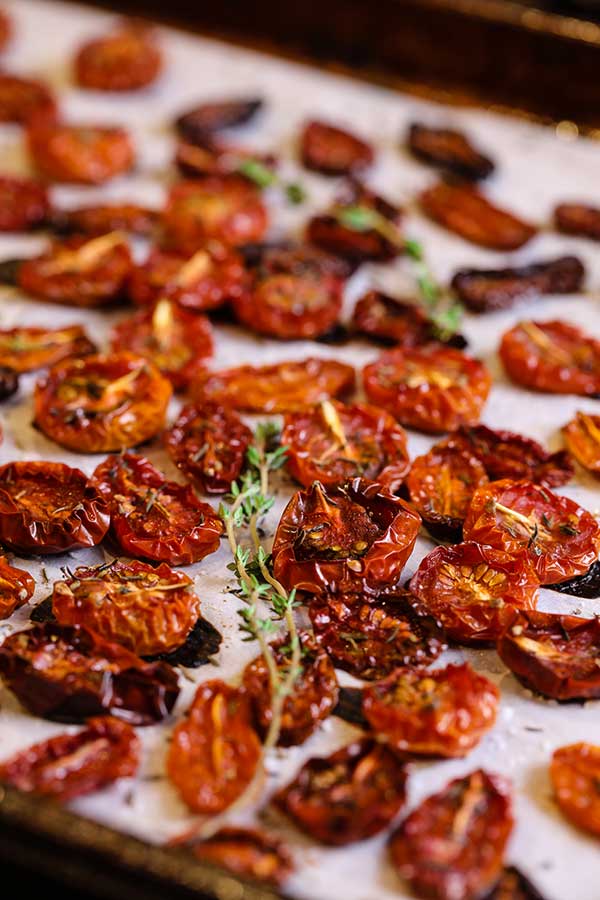 Freshly roasted tomatoes removed from the oven and cooling