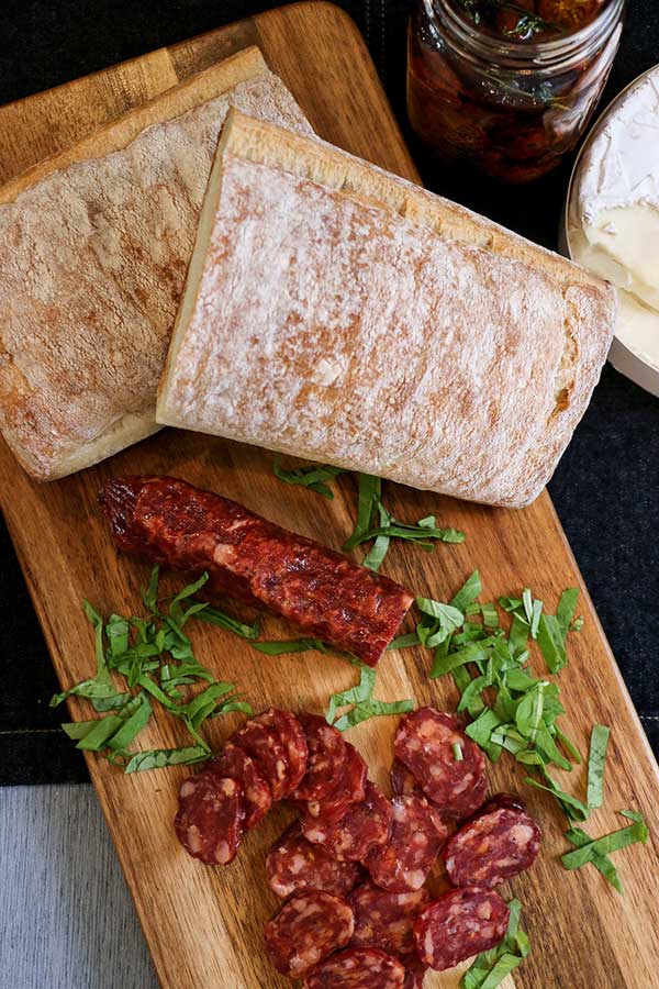 Ciabatta loaf and sliced salami