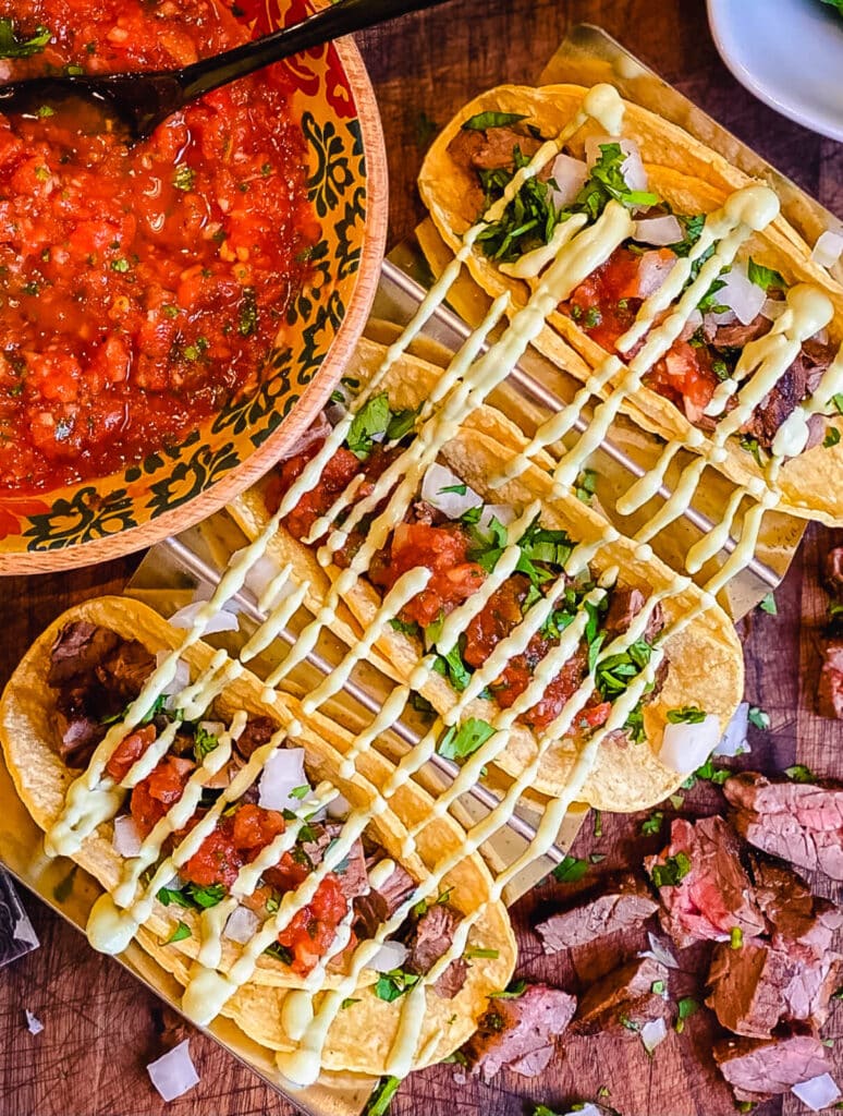 bowl of restaurant style salsa with steak tacos
