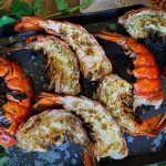 Grilled lobster tail halves ready to serve
