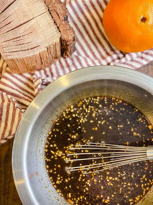 Marinade ingredients whisked together in a metal bowl