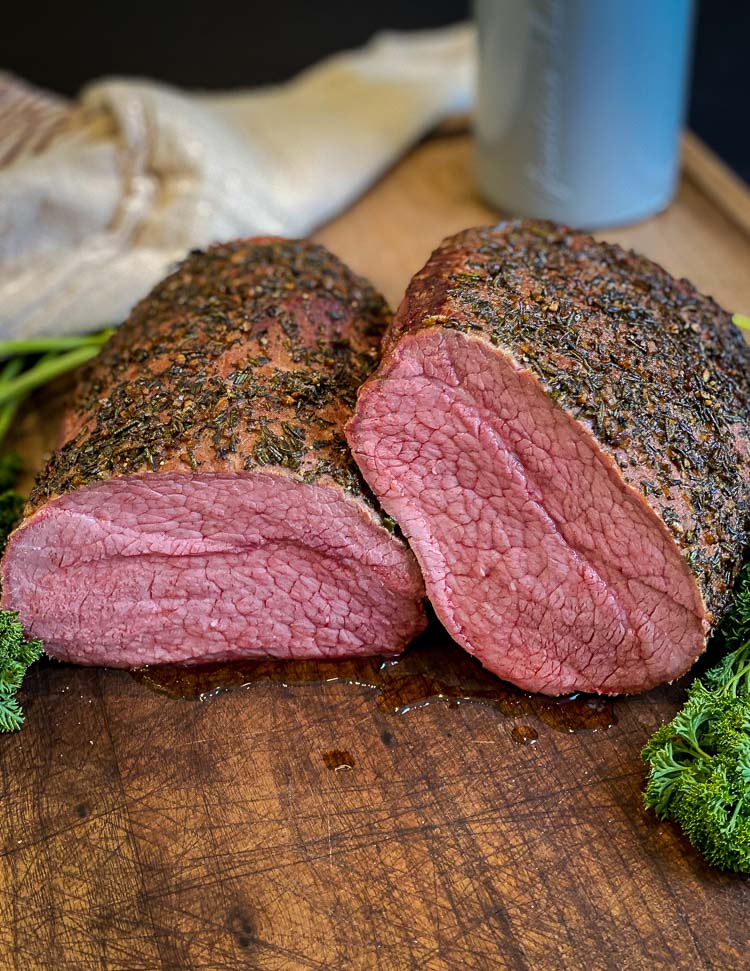 image of a smoked eye of round roast sliced in half