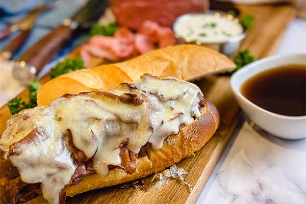 Fresh bread, homemade horseradish sauce and au jus sauce combined with smoked roast beef