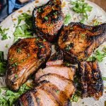grilled pork chops drizzled with Watkins organic spiced maple marinade