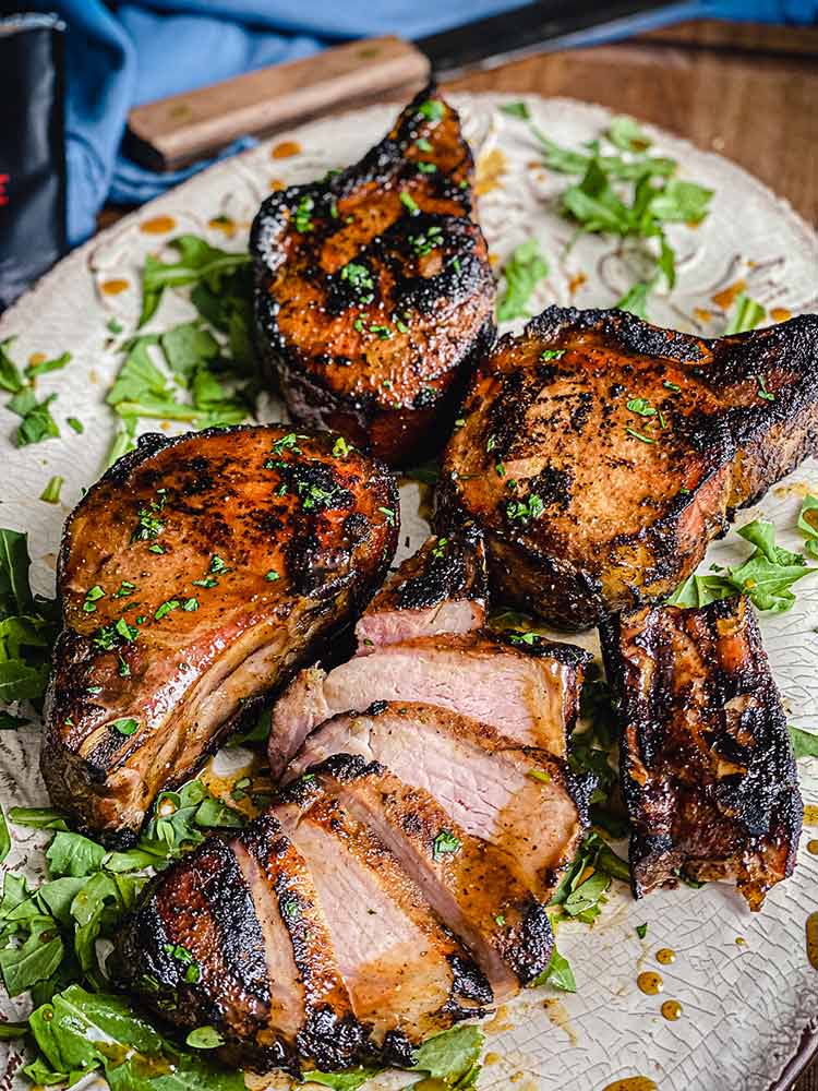 grilled pork chops drizzled with Watkins organic spiced maple marinade