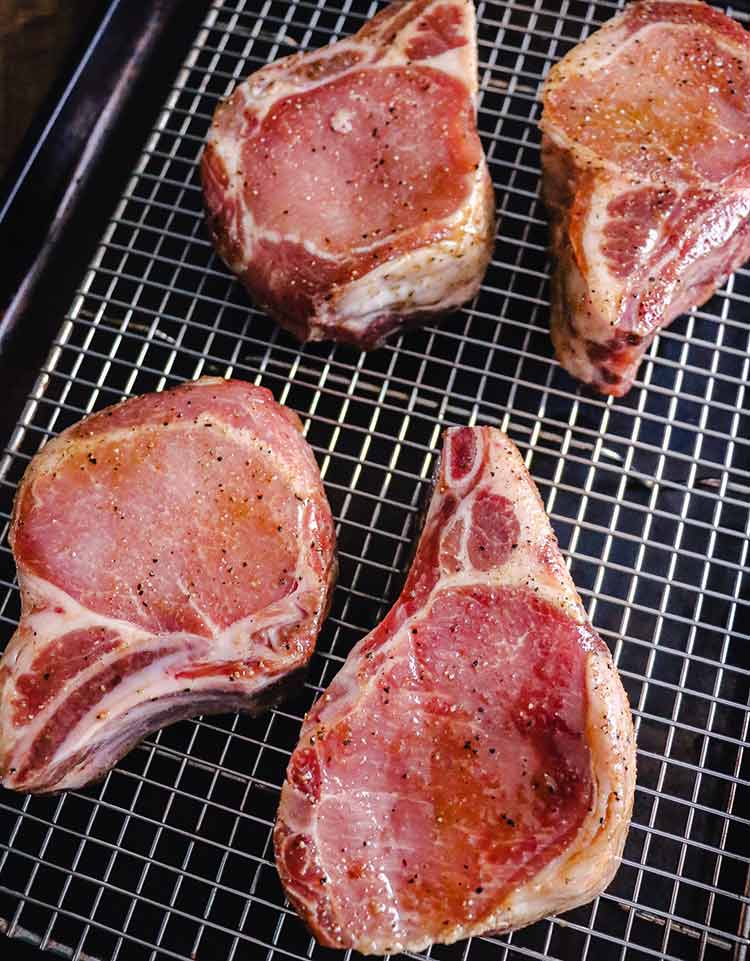 marinated pork chops ready to grill