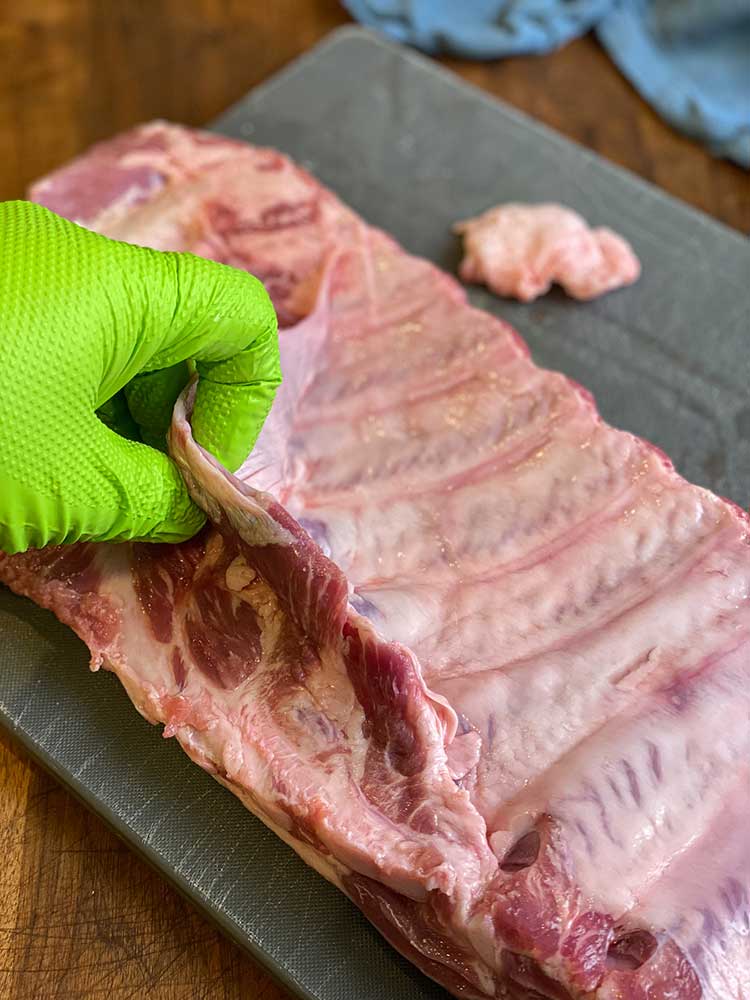 Trim excess fat from ribs