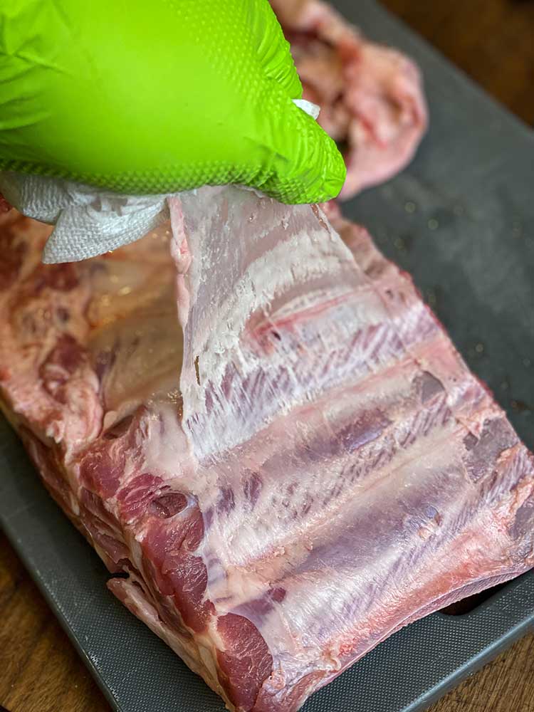 Remove the membrane from ribs by peeling it off