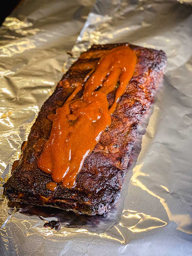 St. Louis Style ribs glazed with sauce