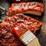 Homemade bbq sauce with freshly grilled ribs