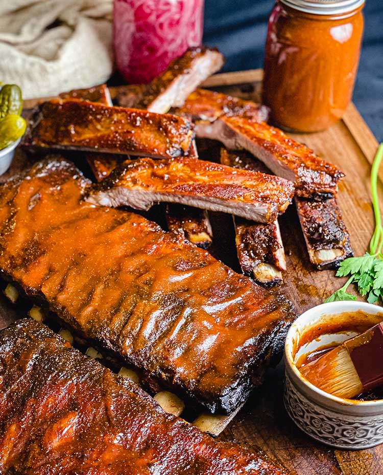 Brush homemade barbecue sauce on ribs