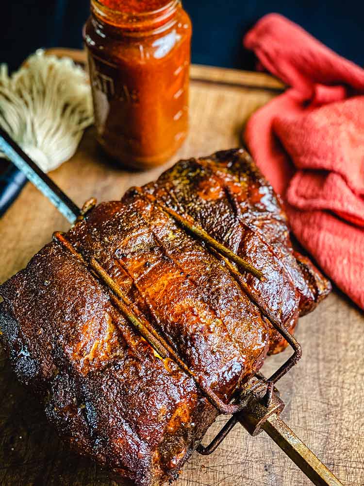 rotisserie smoked pork butt on cutting board