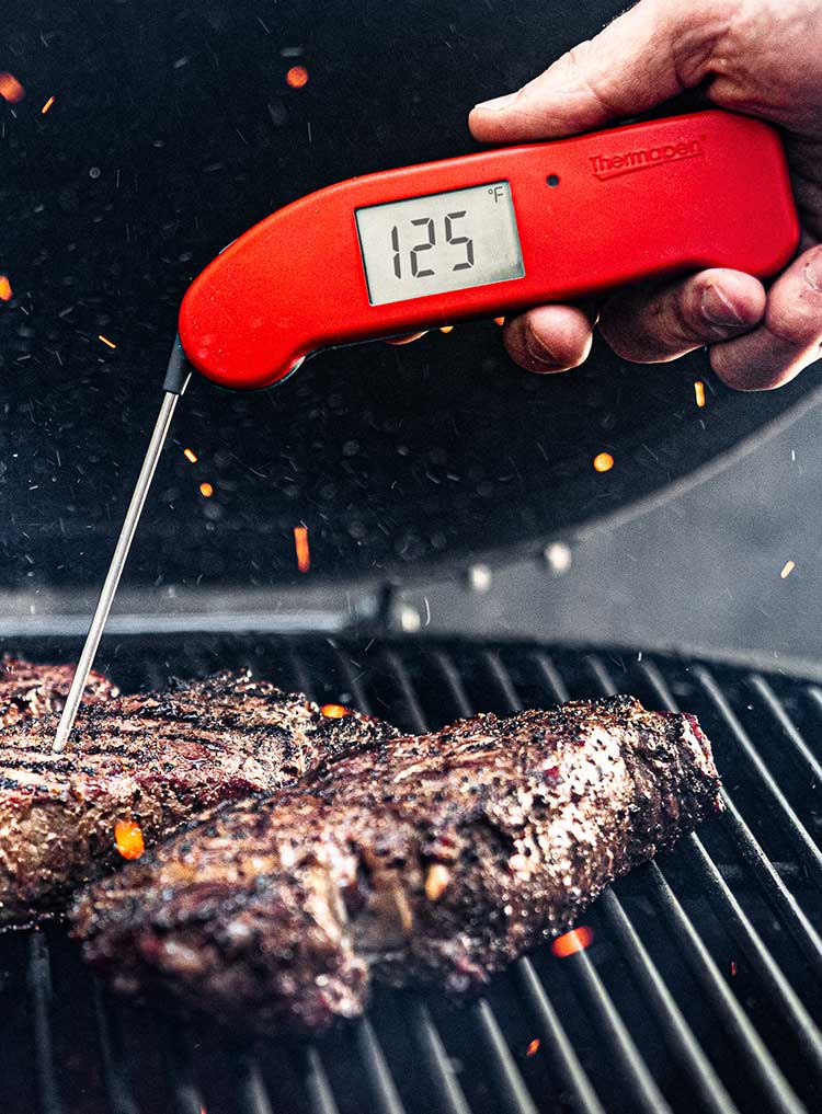 ThermoWorks Thermapen One measuring steak temp on a grill