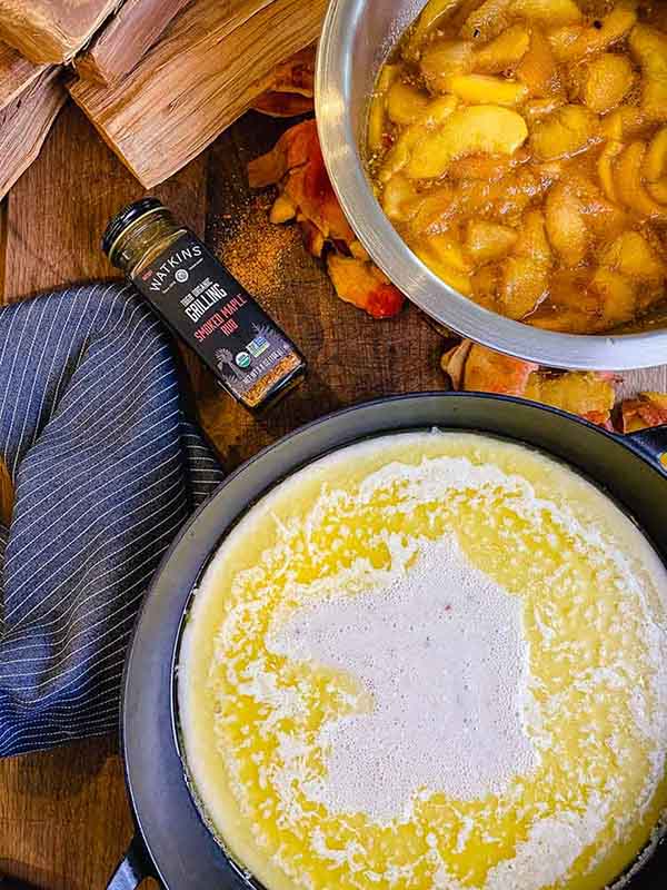 Cobbler batter and melted butter in cast iron pan