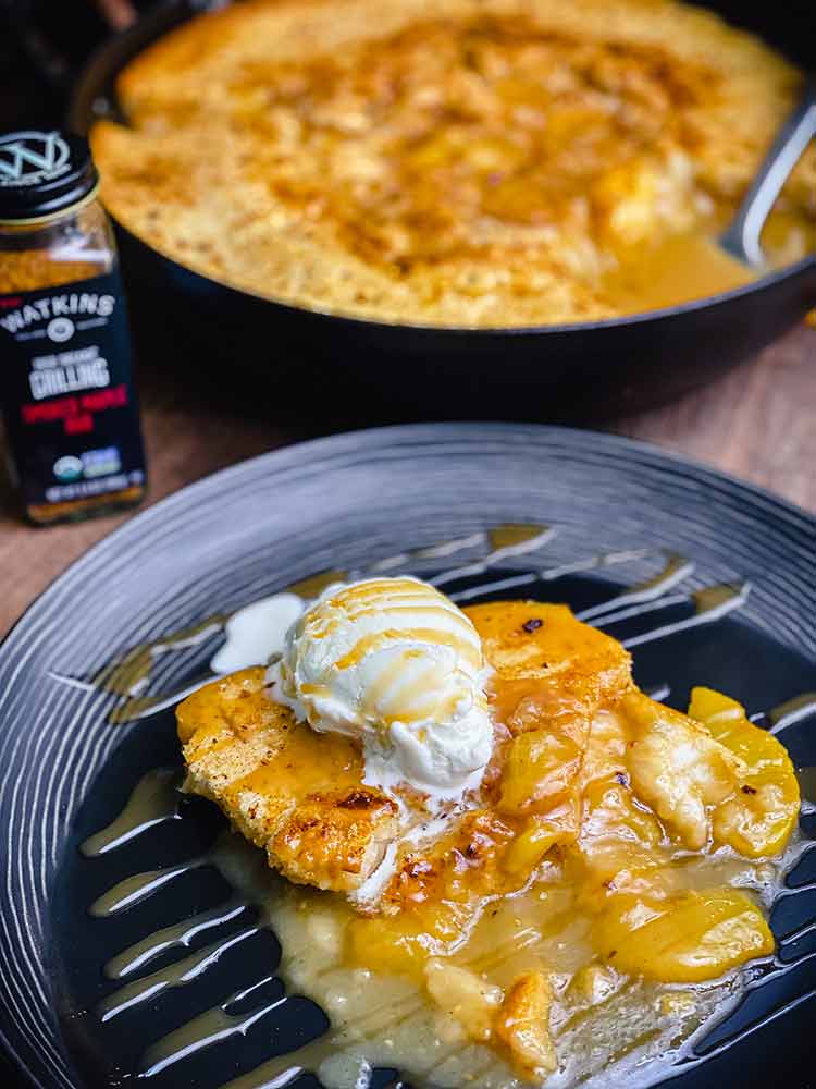 Peach cobbler topped with ice cream