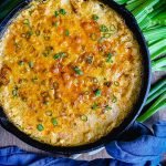 smoked chicken buffalo dip sprinkled with green onions and ready to eat