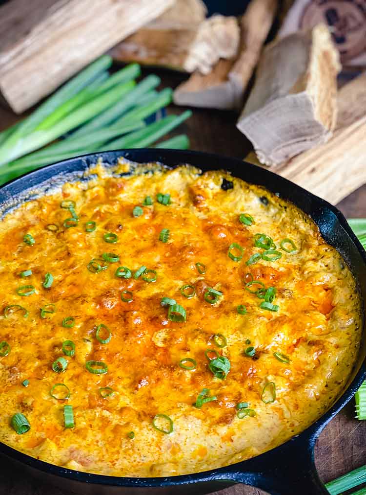 Smoked buffalo chicken dip in a cast iron pan