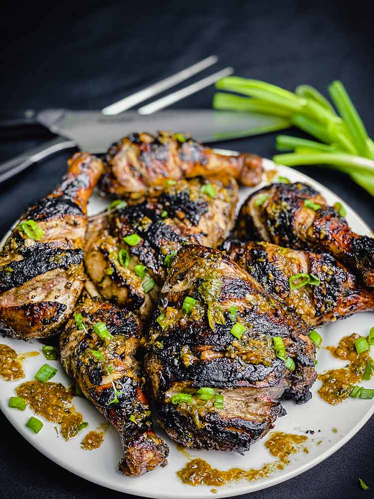 plate of caribbean jerk chicken glazed with jerk sauce