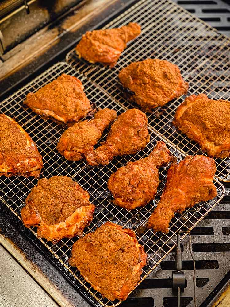 coated chicken on a grill rack