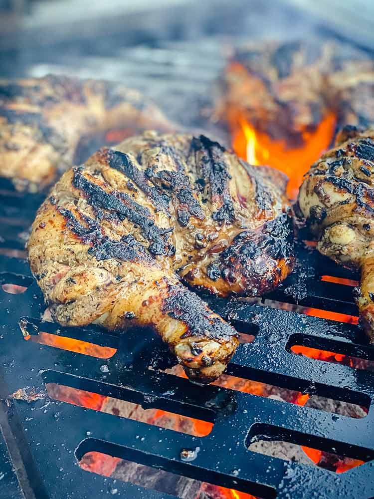 close up of charred chicken quarter