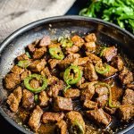 skillet of spicy cajun steak bites seared for the flavor of the Maillard reaction with Cajun spices