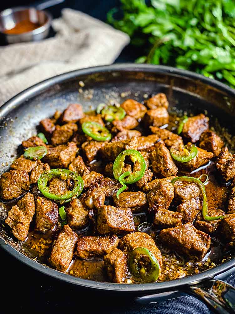 skillet of Cajun seasoned steak bites ready to serve