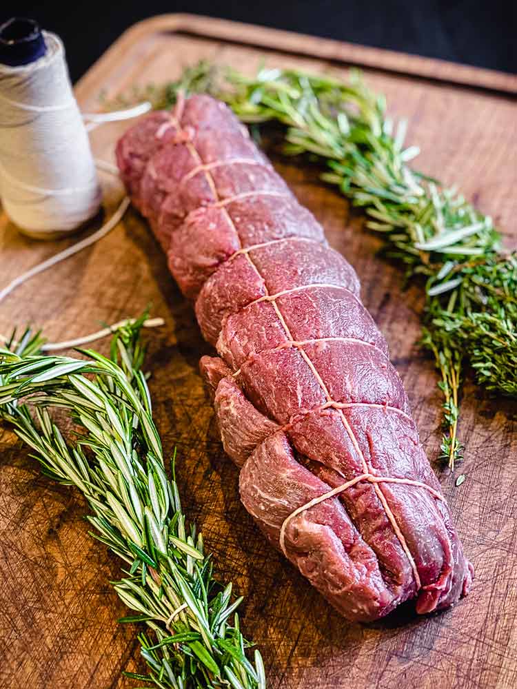 uncooked center cut tied and ready for the grill