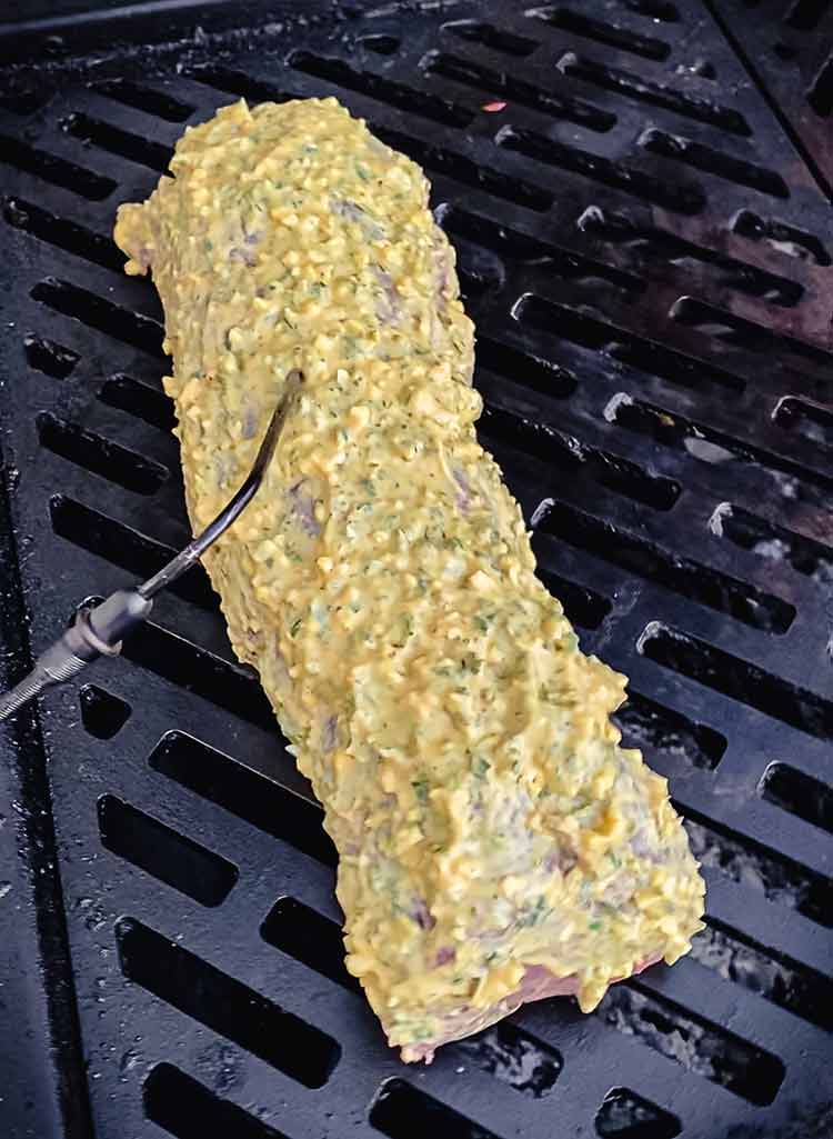 leave-in thermometer inserted into meat on the grill