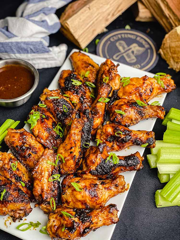 chicken wings, perfectly grilled, charred and drizzled with mop sauce. 
