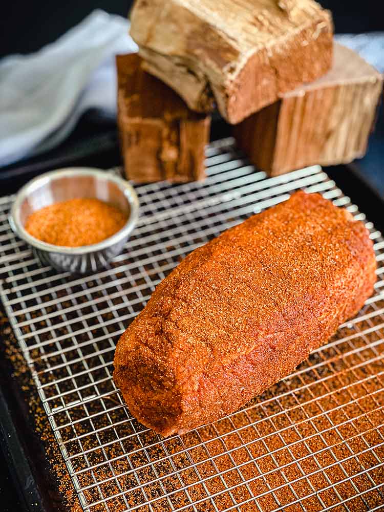 homemade rub sprinkled over pork butt, specifically the pork collar