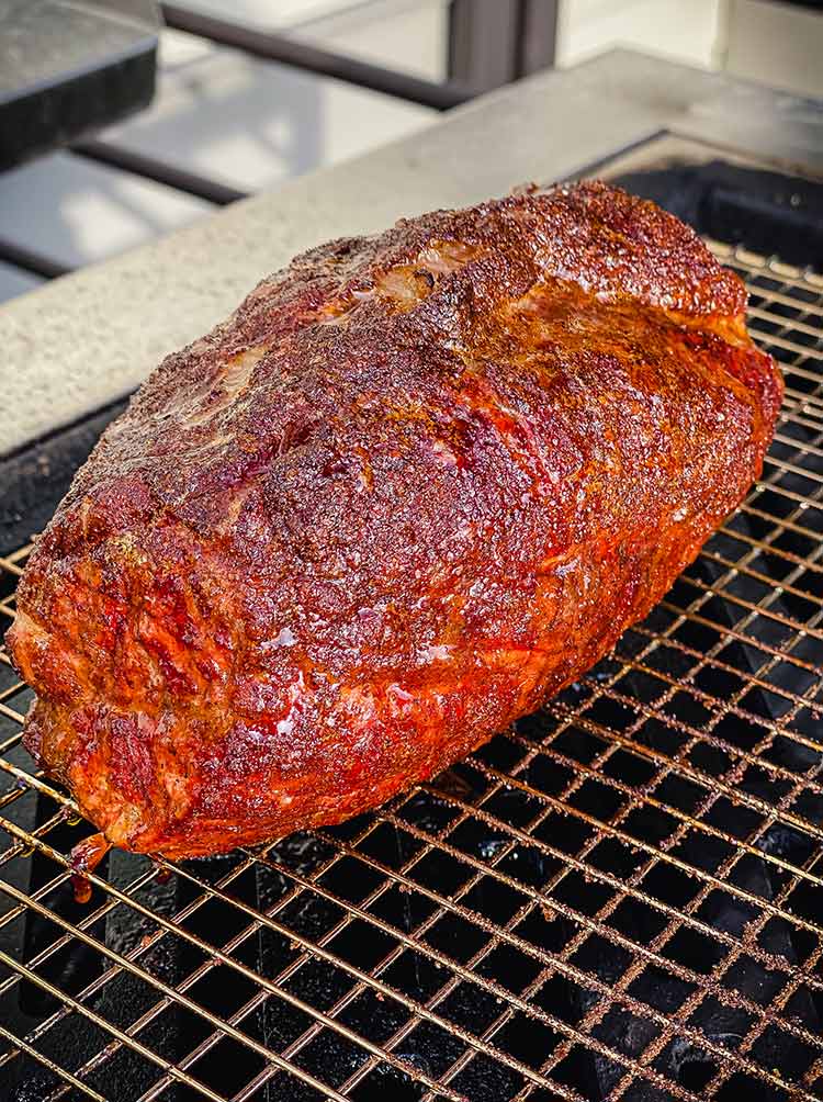 smoked coppa roast cooking on grill