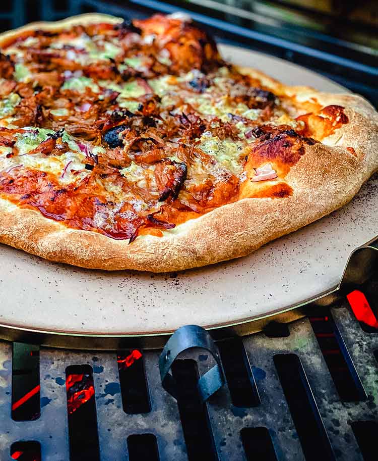 close up of pizza on a pizza stone