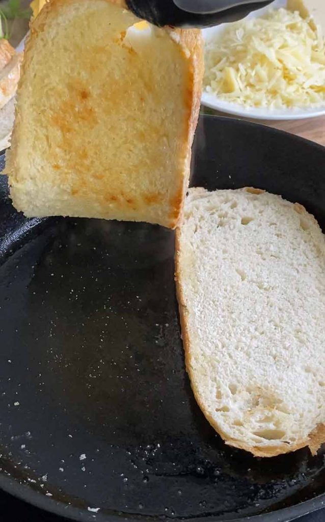 lightly toast one side of the bread in melted butter 