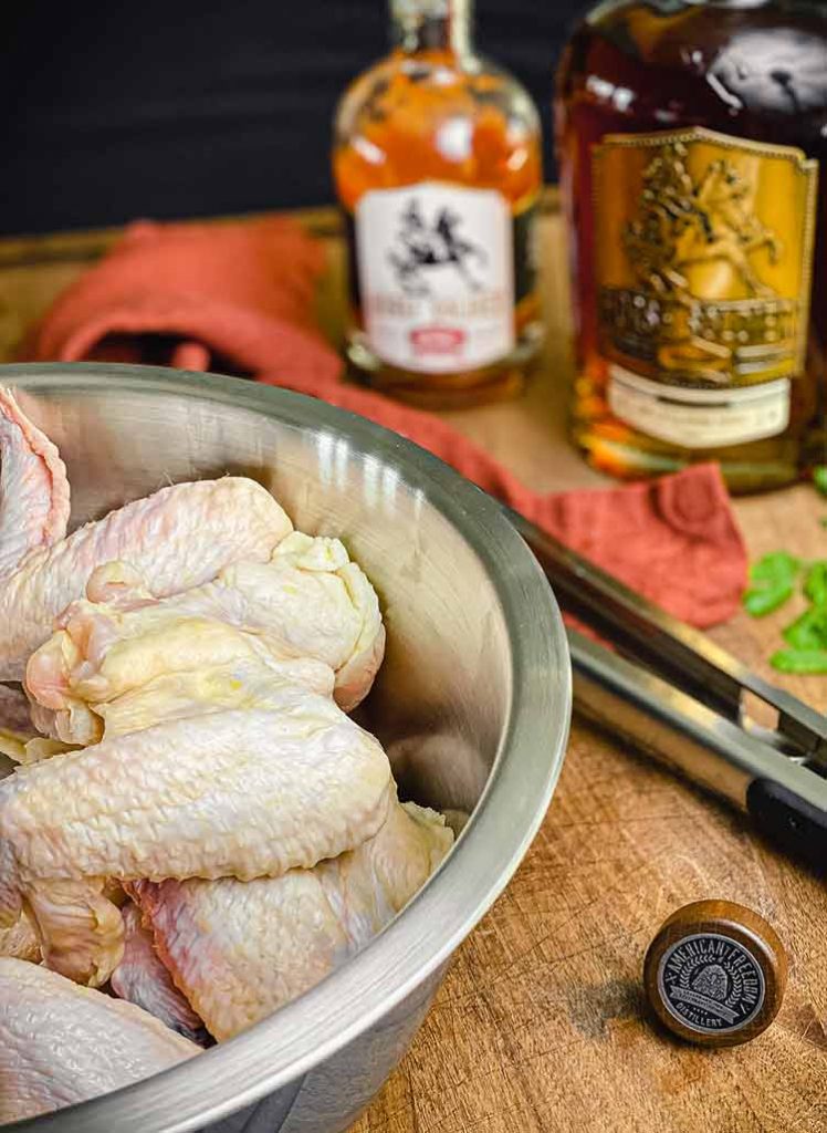 raw chicken in a steel bowl 